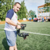 Die Eröffnungszeremonie beginnt. Sabir ist mit seiner Kamera dabei und filmt.
